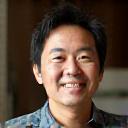 Close-up of Kenji Nakano in a home setting, casually dressed.